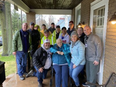 Group photo after volunteers help build a ramp.